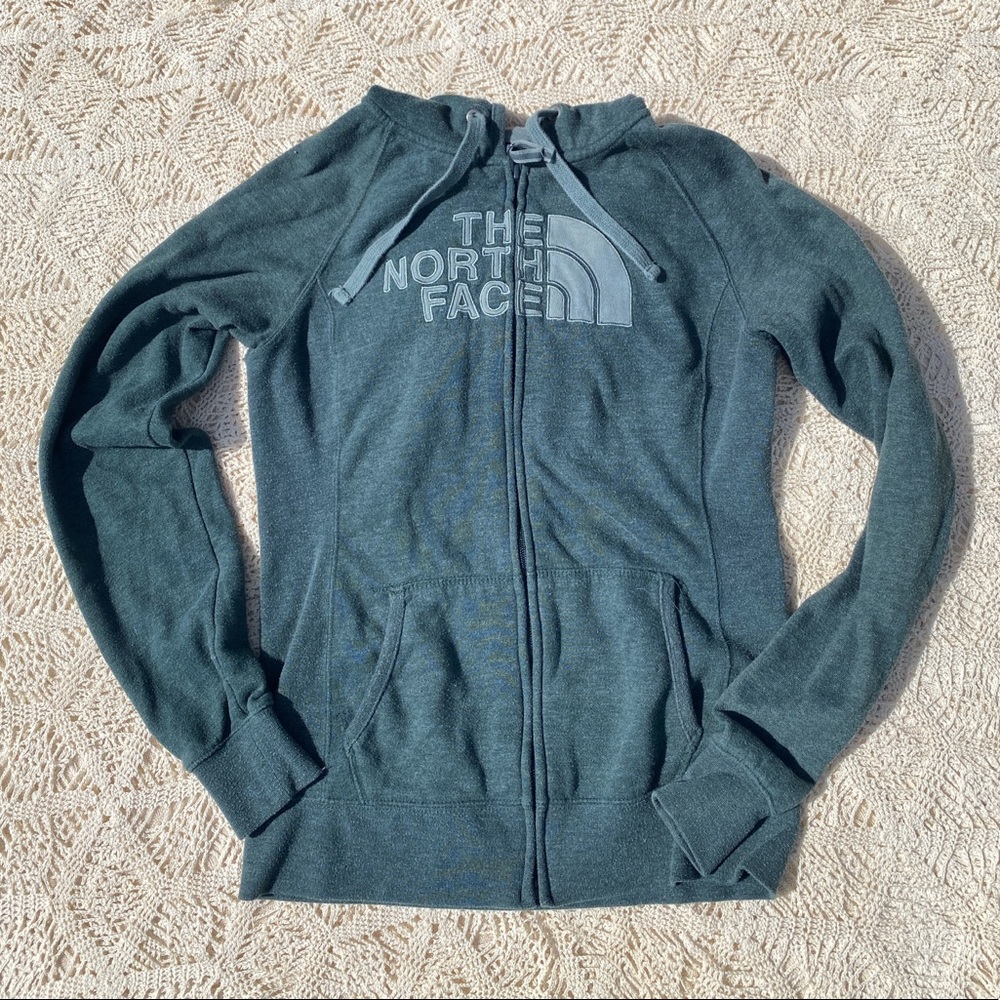 The North Face zip up green jacket.